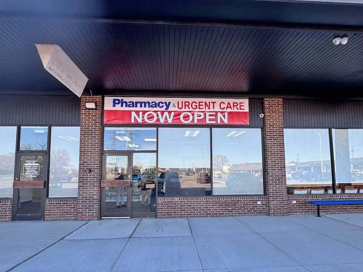 Storefront exterior of WeCare Urgent Care with the pharmacy and urgent care banner above the entrance